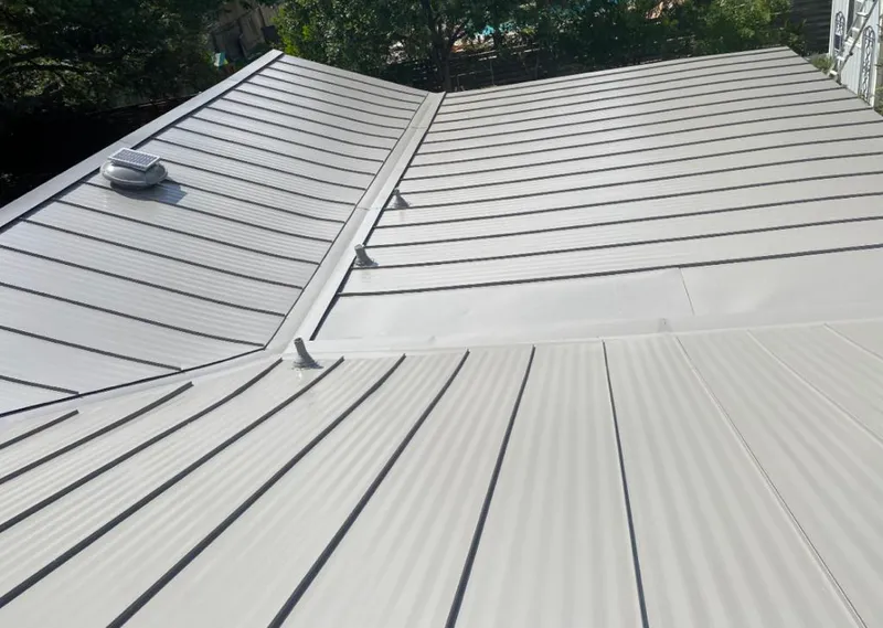 Solar attic fan installed on a metal roof for Roof Ventilation in Apollo Beach